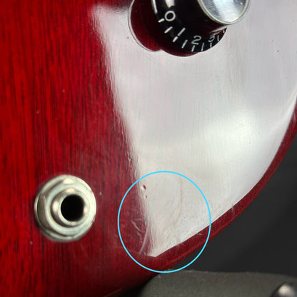 Scratches and dings near output jack of Used Gibson SG Jr Cherry.