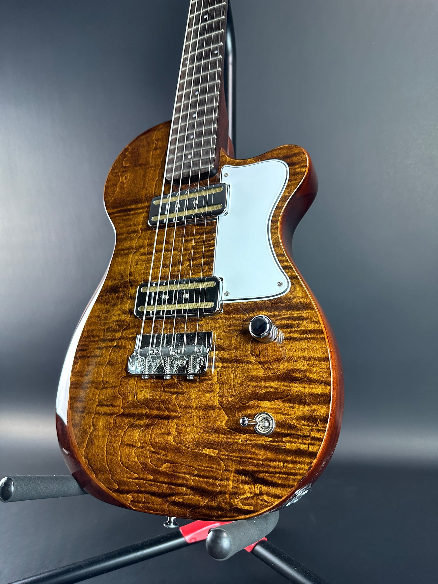 Front angle of Used Harmony Juno Transparent Brown Flame Maple.