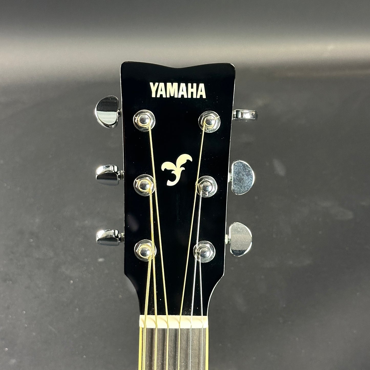 Front of headstock of Used Yamaha FS820 Black.