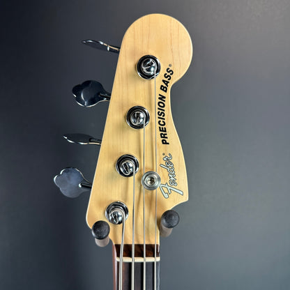 Front of headstock of Used 2013 Fender American Performer P Bass Sunburst.