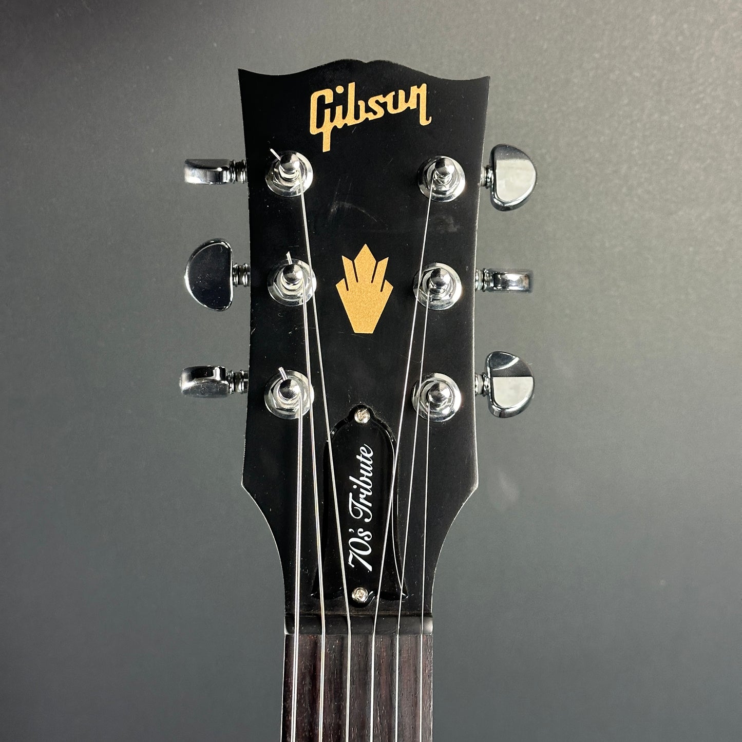 Front of headstock of Used Gibson SG 70's Tribute Black.