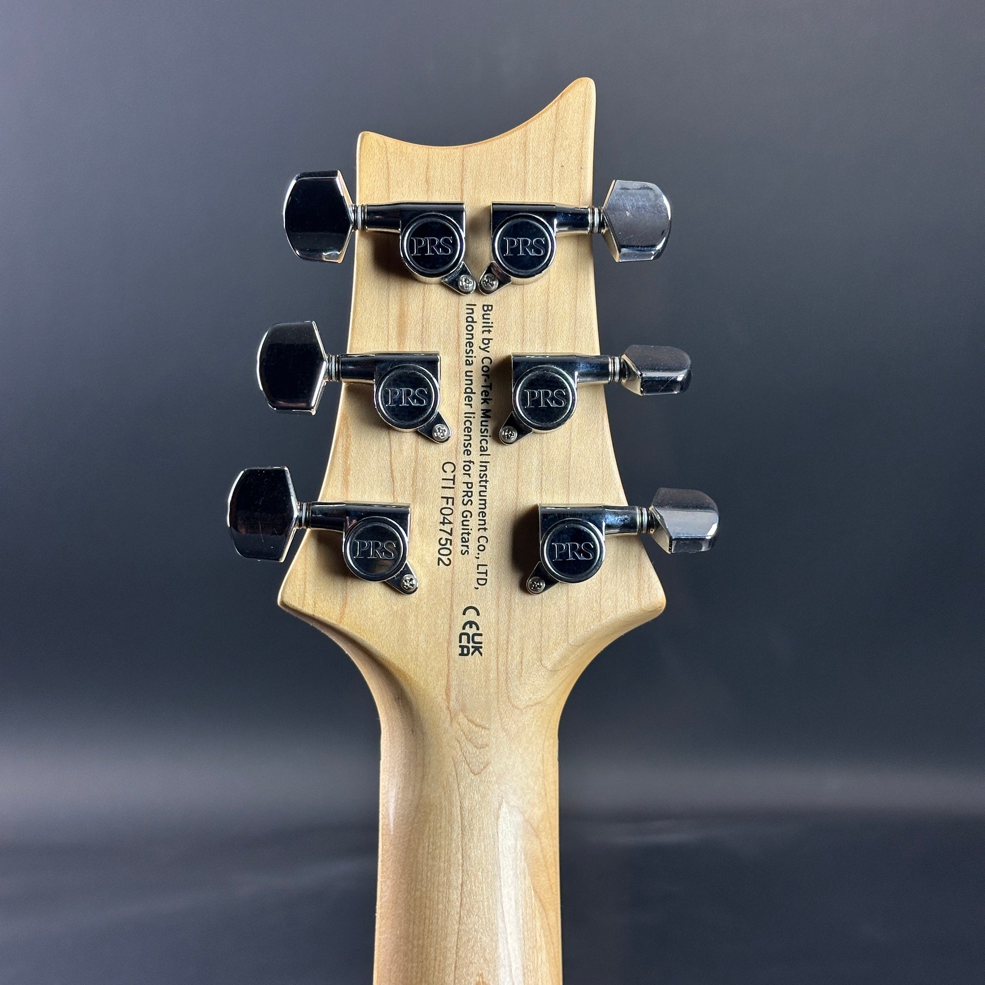 Back of headstock of Used PRS SE Special Charcoal.