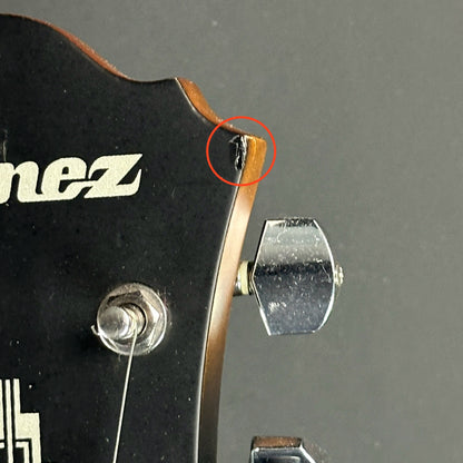 Chip on front of headstock of Used Ibanez Artcore AF55-TF Tobacco Flat.