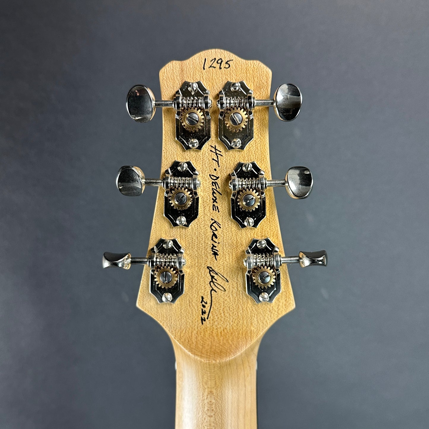 Back of headstock of Used 2022 Asher HT DLX Korina.