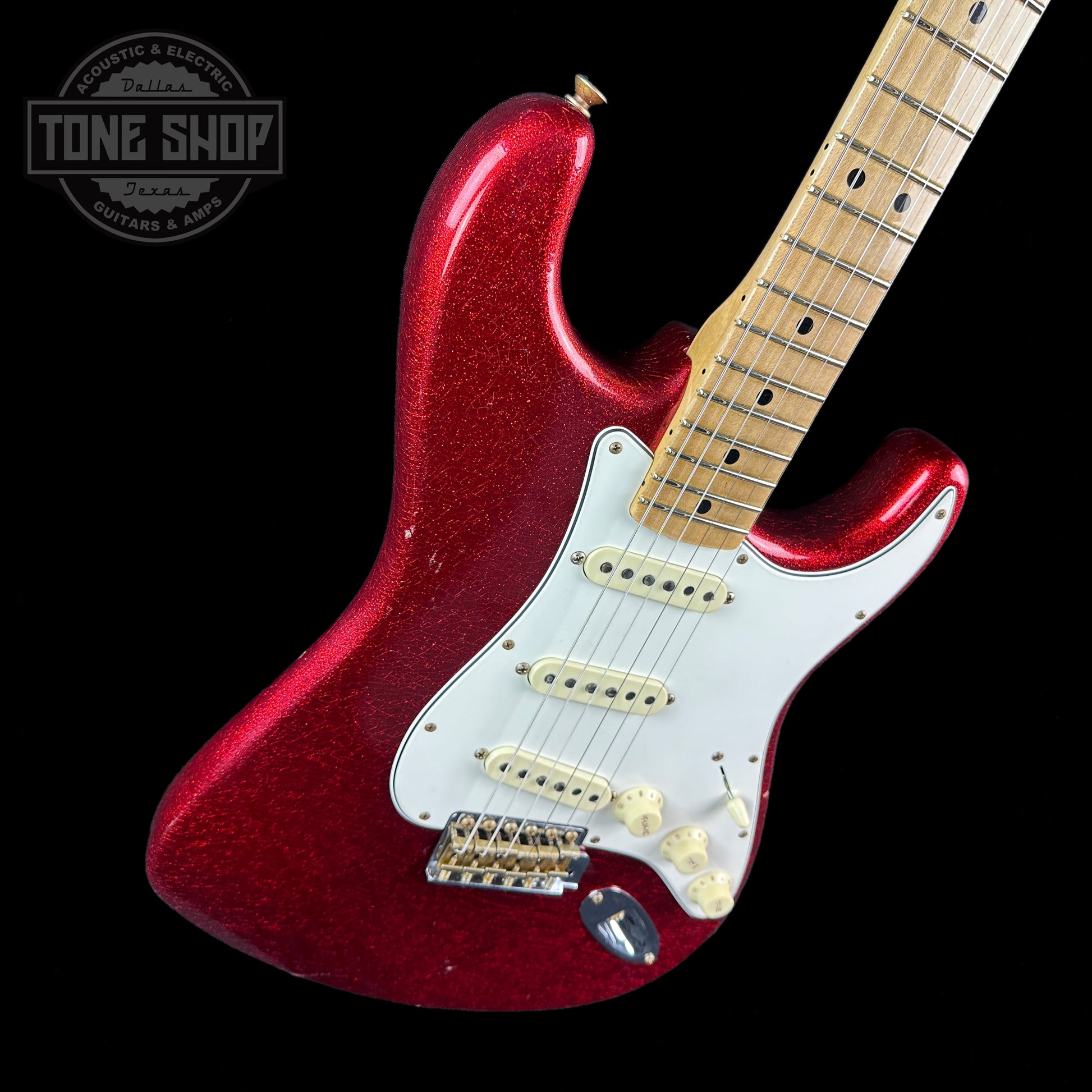 Front angle of Fender Custom Shop Limited Edition 69 Strat Journeyman Relic Aged Red Sparkle.