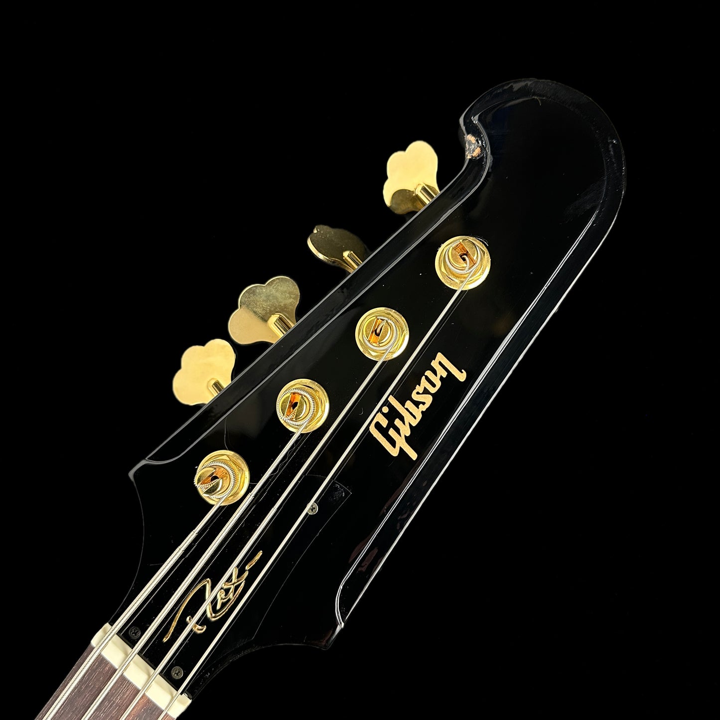 Front of headstock of Used Gibson Rex Brown Thunderbird Ebony.