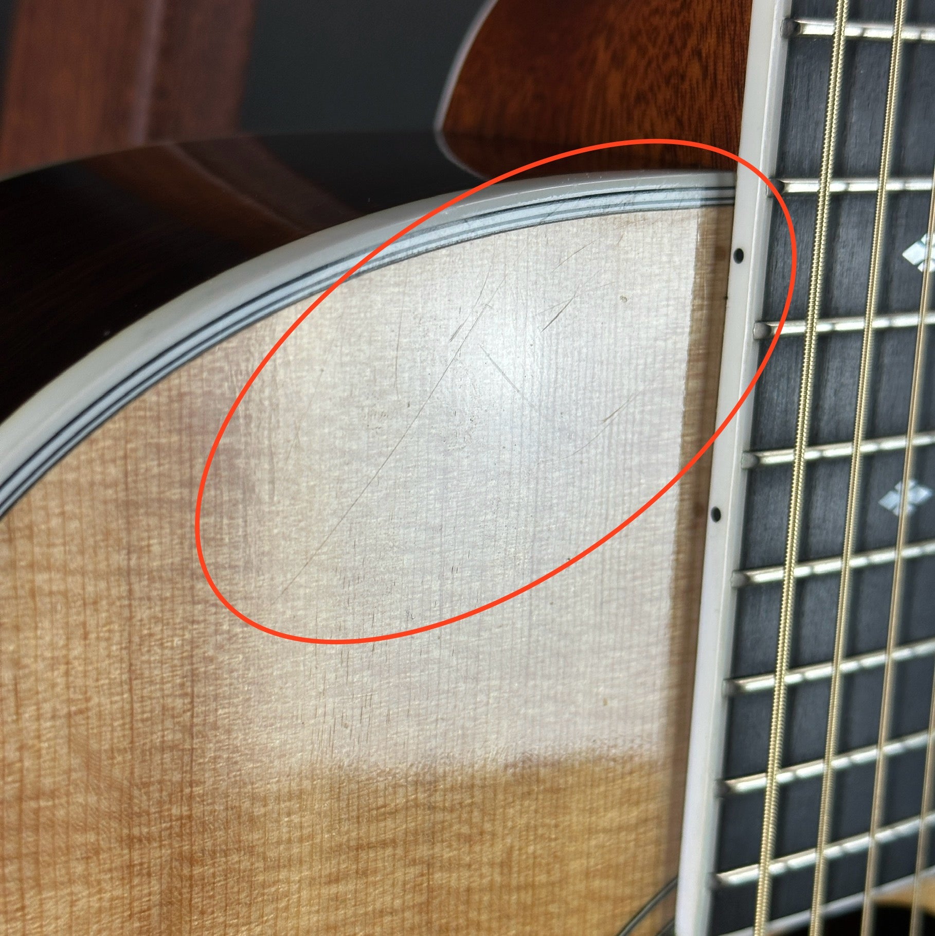 Scratches on front of Used 1992 Taylor 812c Florentine Cutaway.