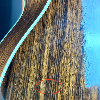 Scratches on back of Used Taylor 815ce.