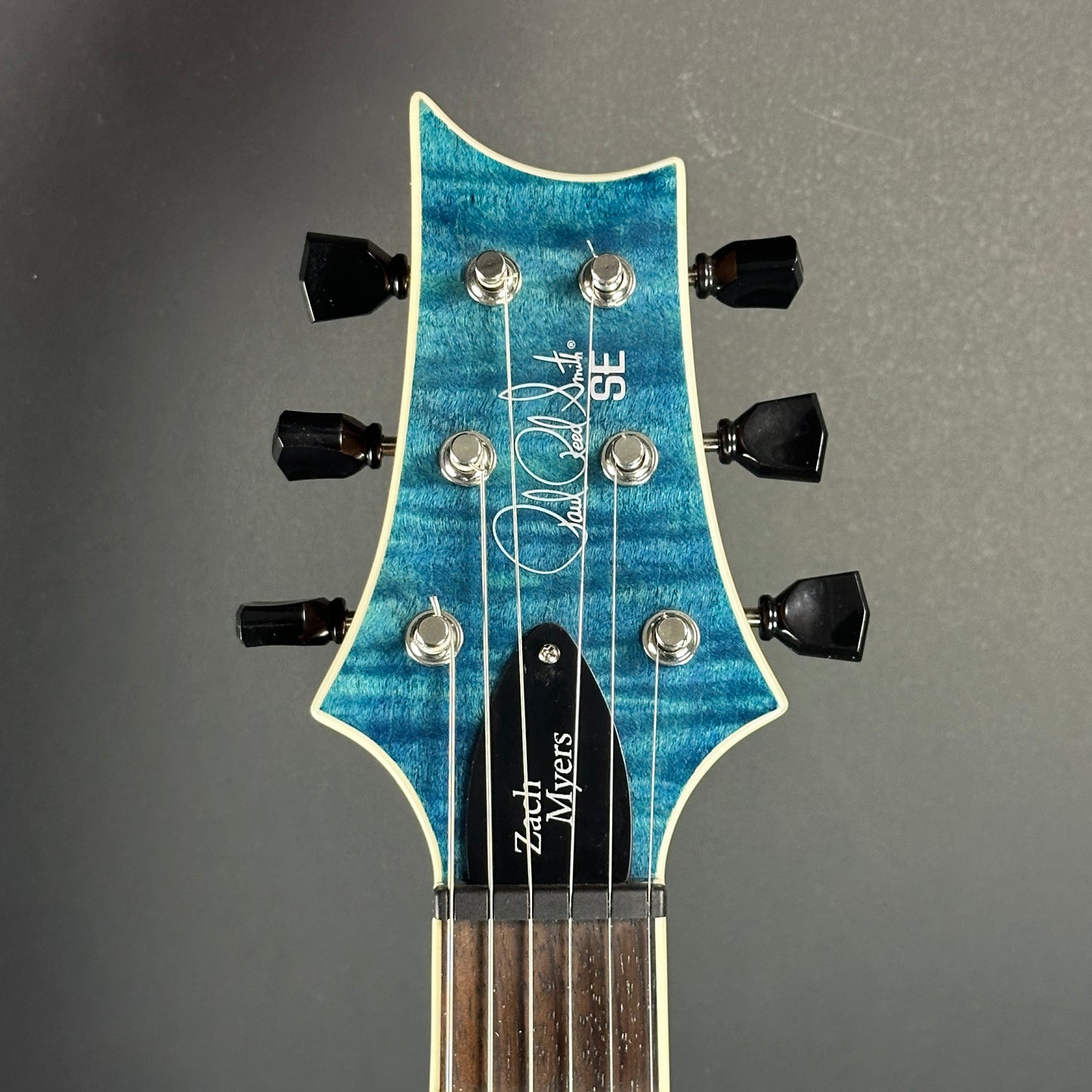 Front of headstock of Used PRS SE Zach Myers.