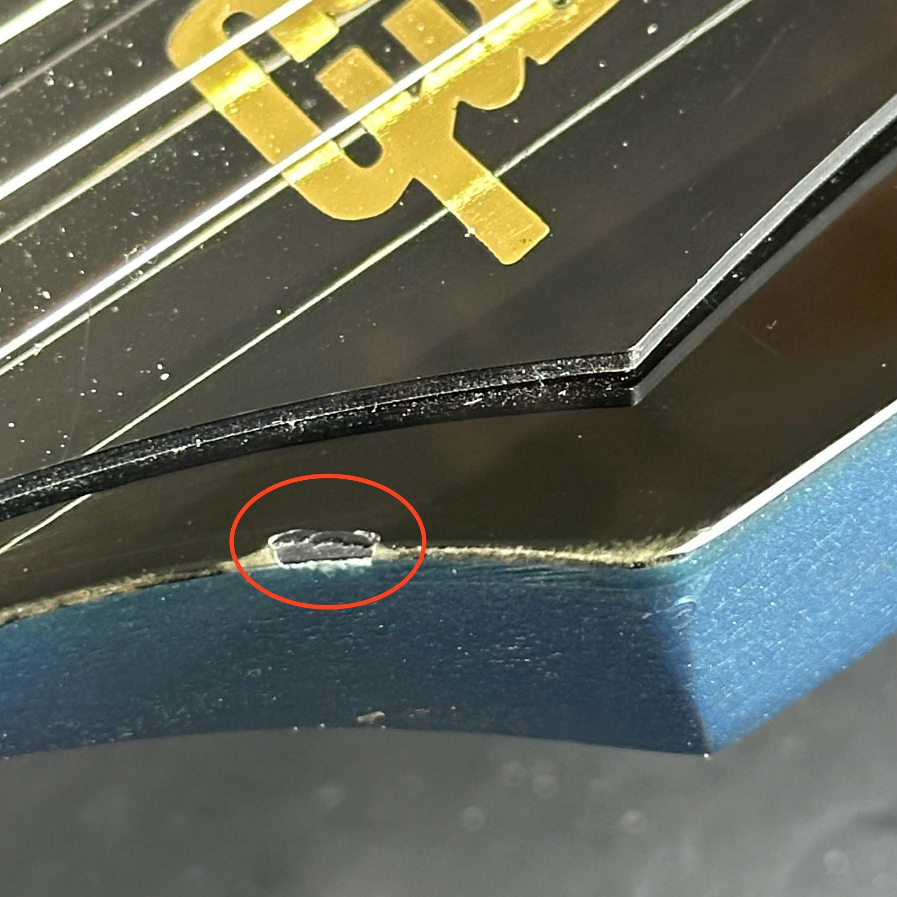 Chip in headstock of Used Gibson Non-Reverse Firebird Pelham Blue.