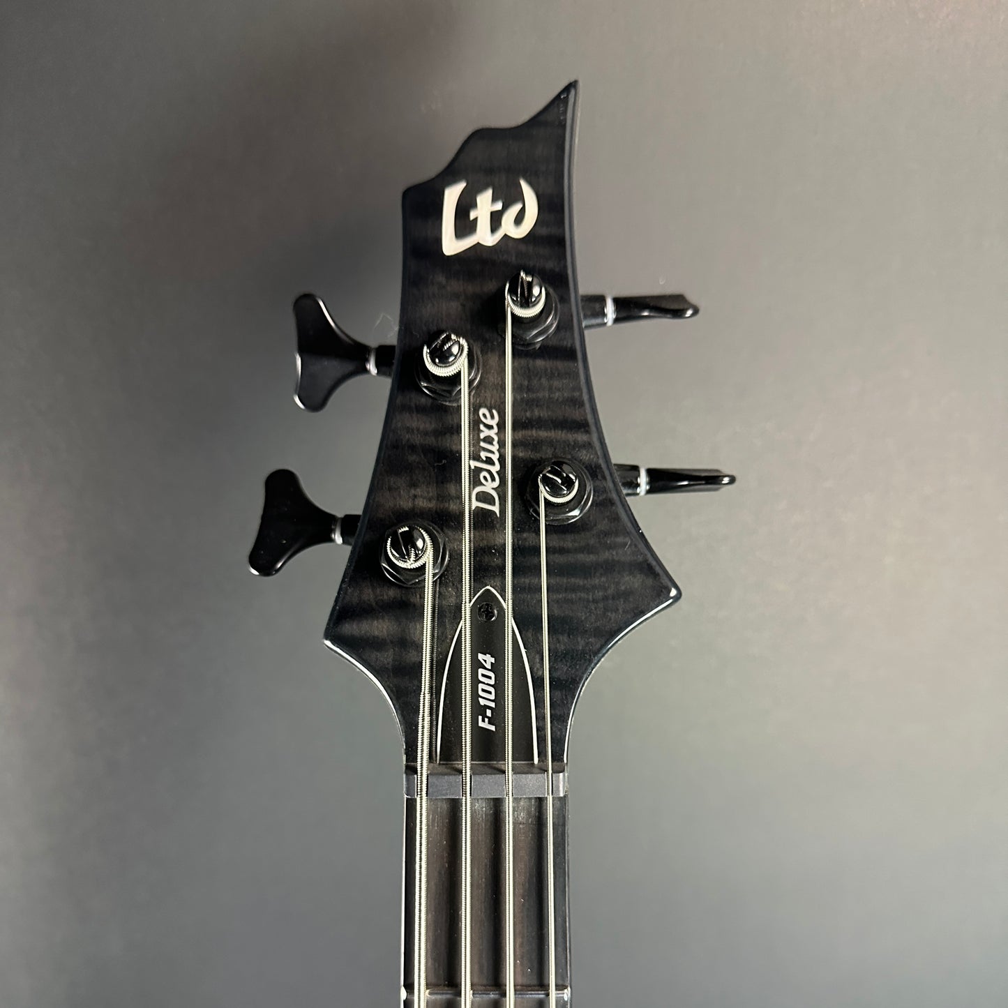 Front of headstock of Used ESP LTD F1004 DLX Greyburst.