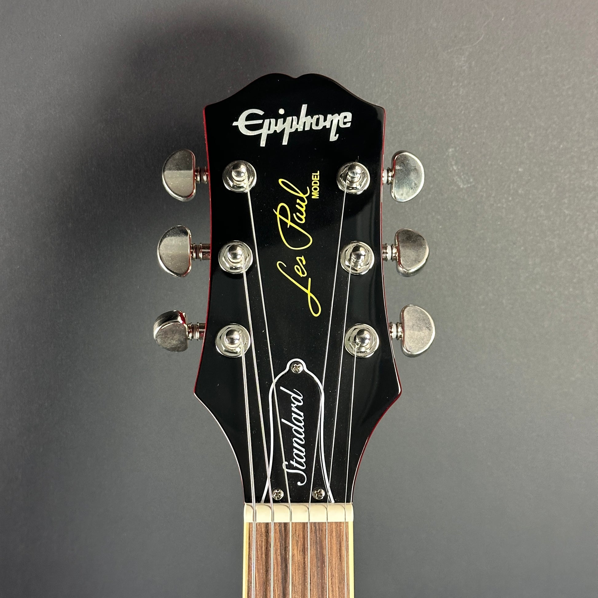 Front of headstock of Used Epiphone Les Paul Standard Sunburst.