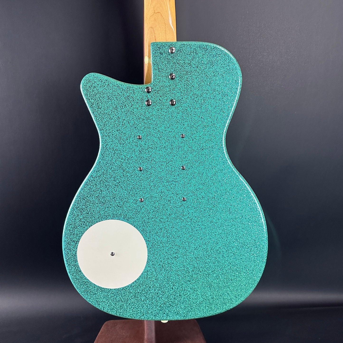 Back of body of Used Danelectro '56 U3 Green Sparkle.