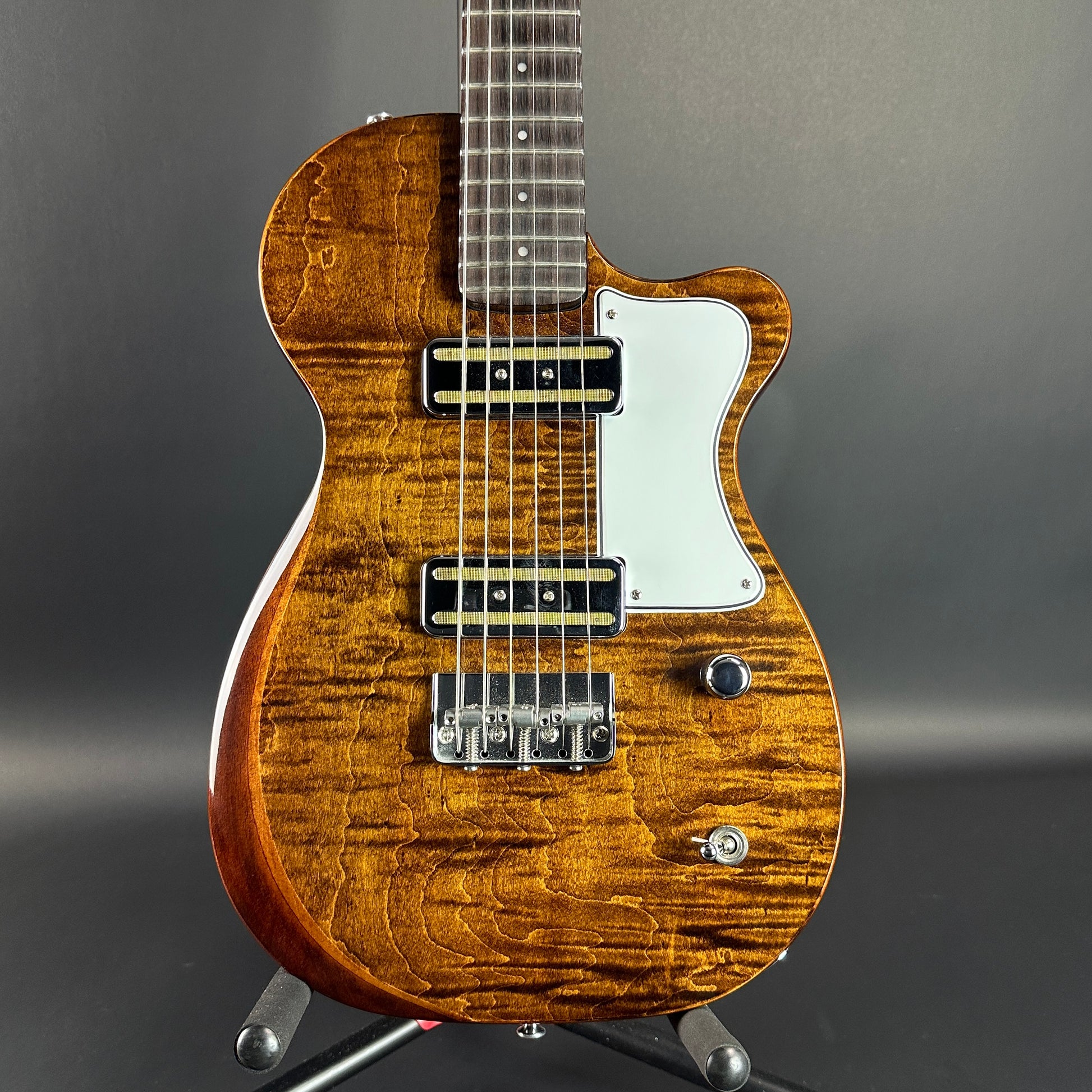 Front of Used Harmony Juno Transparent Brown Flame Maple.