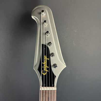 Front of headstock of Used Epiphone Inspired By Gibson Custom 1963 Firebird I Silverburst.