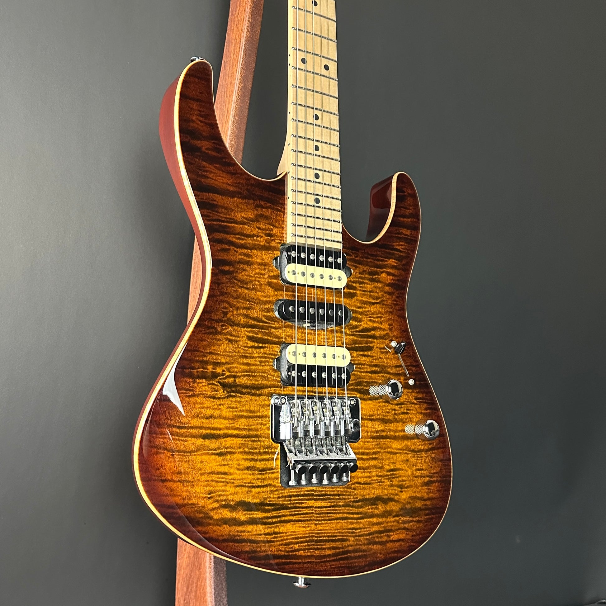 Front angle of Used 2015 Suhr Modern Pro Flame Top HSH Floyd Rose.