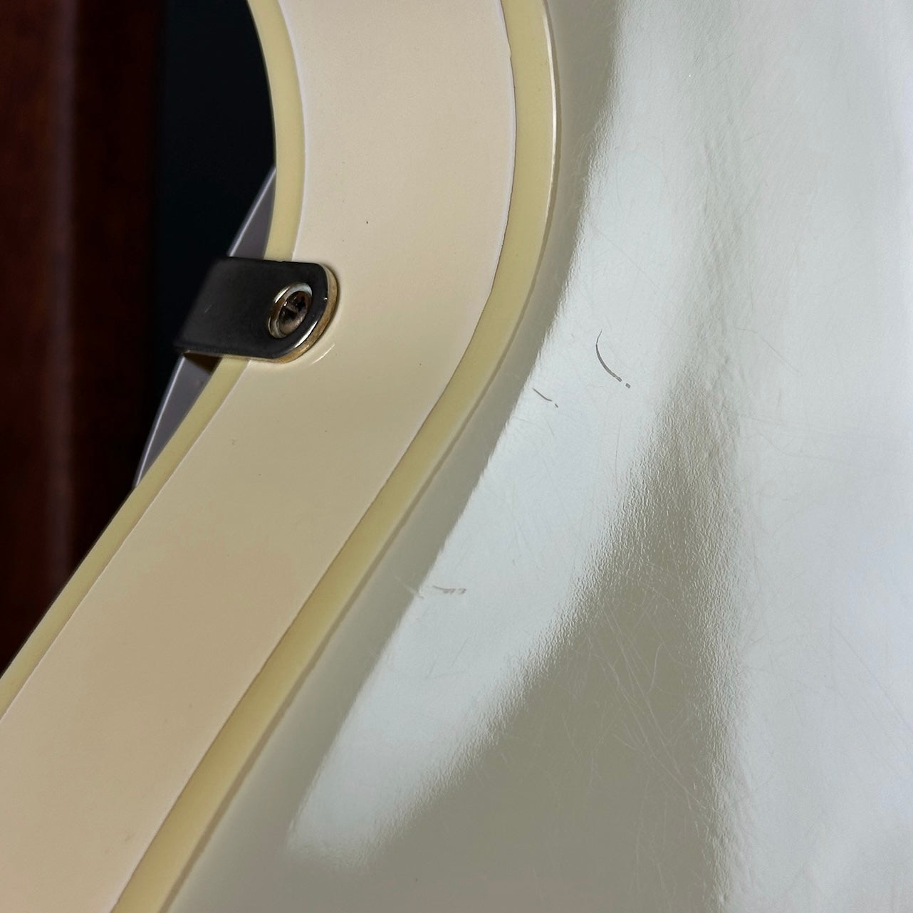 Scratches on back of Used Epiphone ES-345 Antique White.