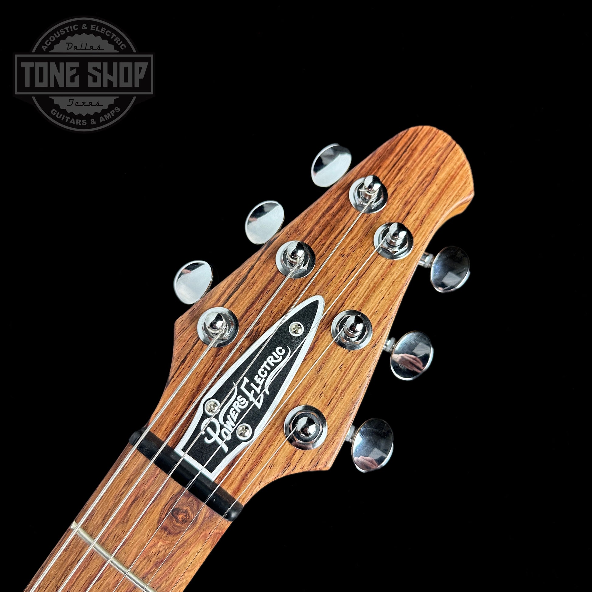 Front of headstock of Powers Electric A-Type Fern Green PF42 Firestripe Delrin Warm CamTail.