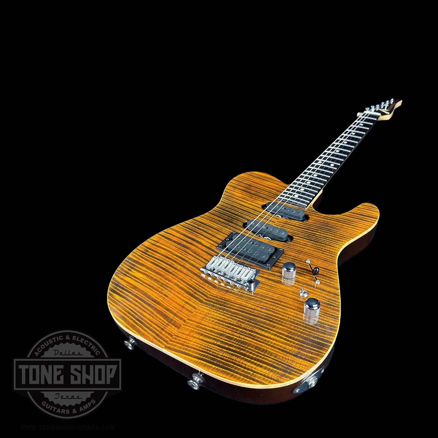 Front angle of Used Tom Anderson Hollow T Drop Top Tiger Eye.