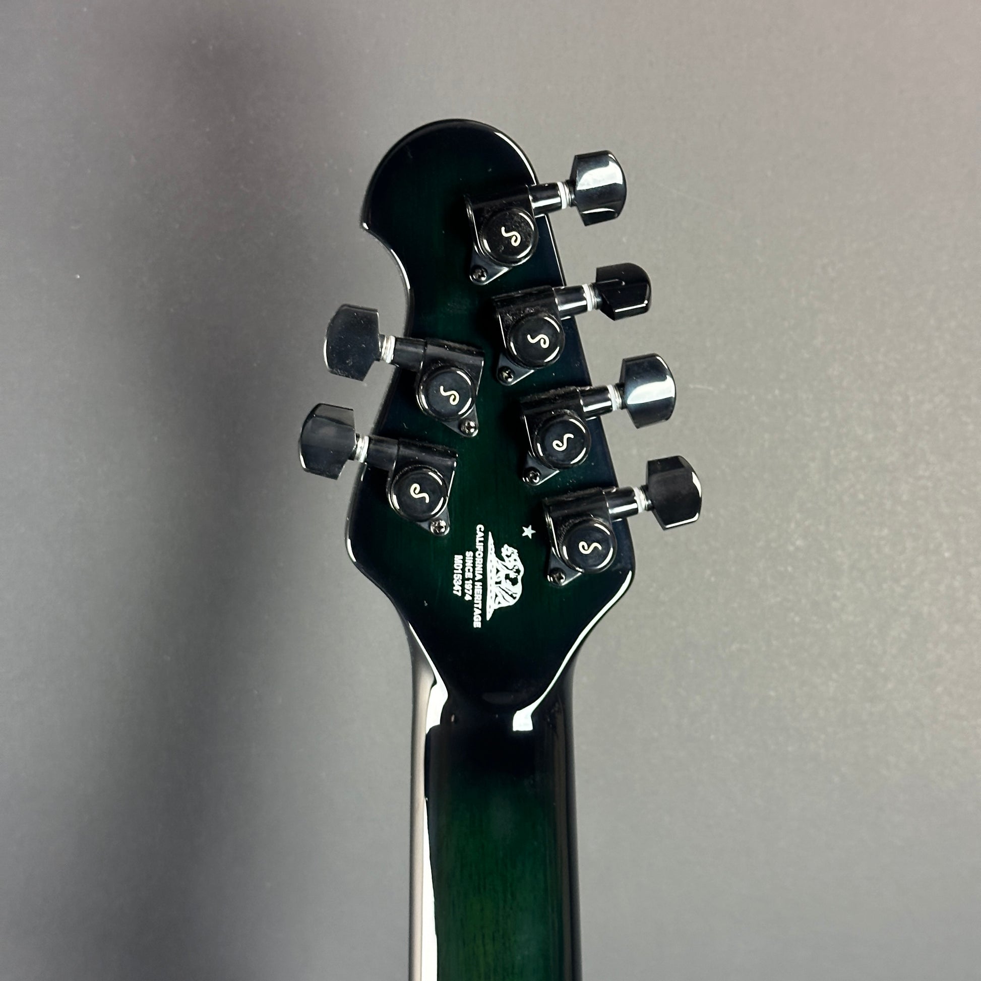 Back of headstock of Used Ernie Ball MusicMan Majesty 6 John Petrucci Gravity Green.