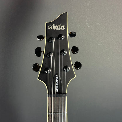 Front of headstock of Used Schecter C-1 Apocalypse Carbon Black.