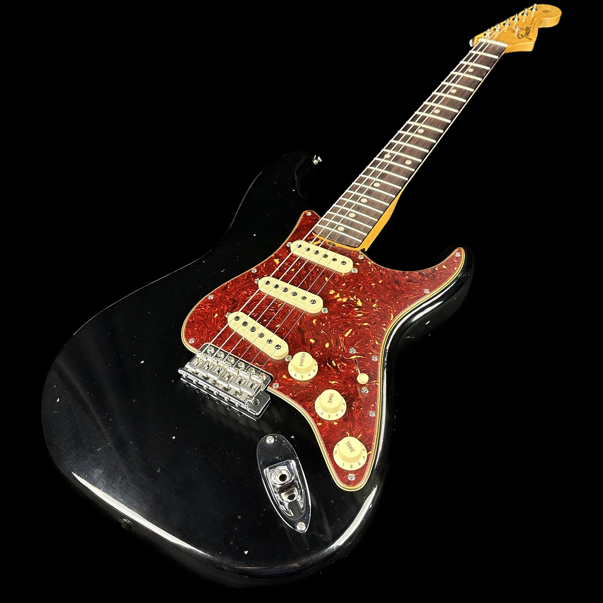 Front angle of Fender Custom Shop Postmodern Strat RW Journeyman Relic w/Closet Classic Hardware Aged Black.