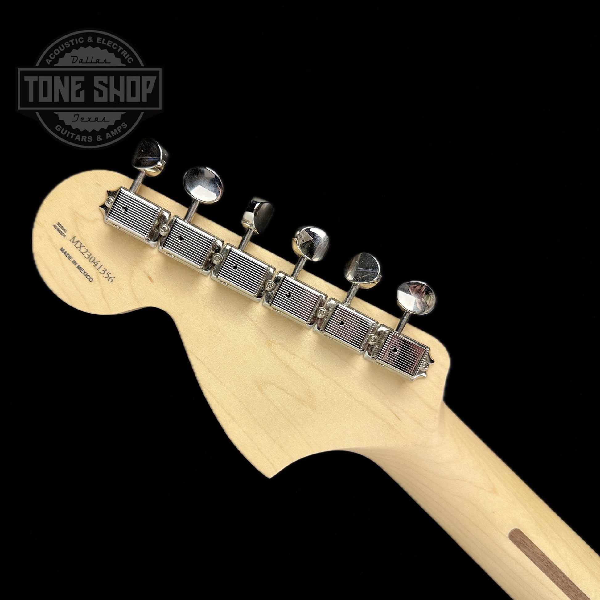 Back of headstock of Used 2023 Fender Tom Delonge Stratocaster Daphne Blue.