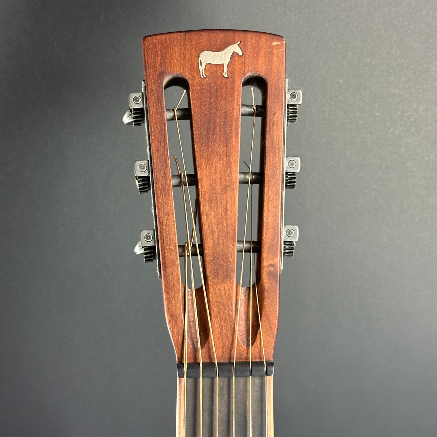 Front of headstock of Used Mule Resonator Guitar.