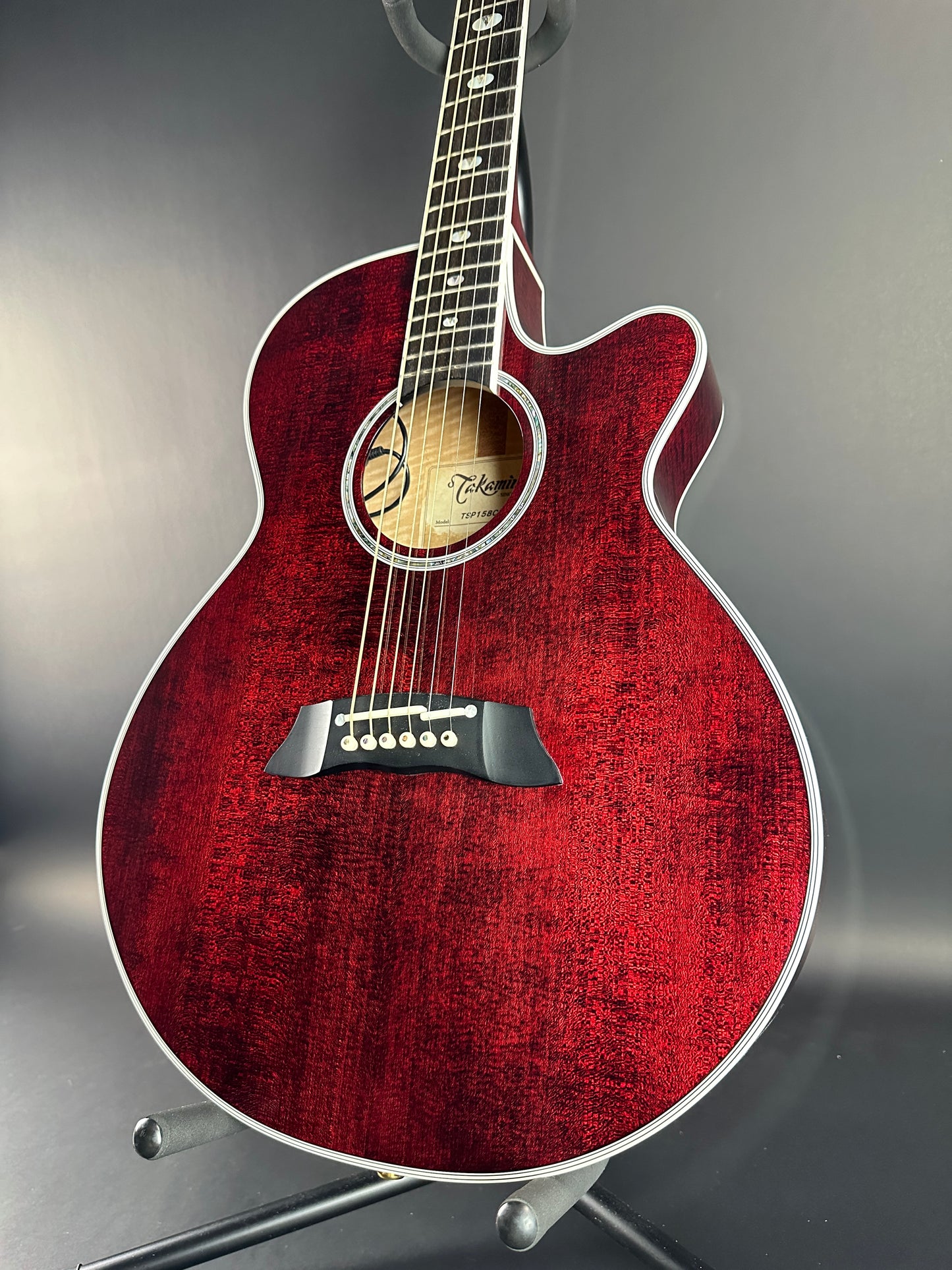 Front angle of Used Takamine TSP158C Red.