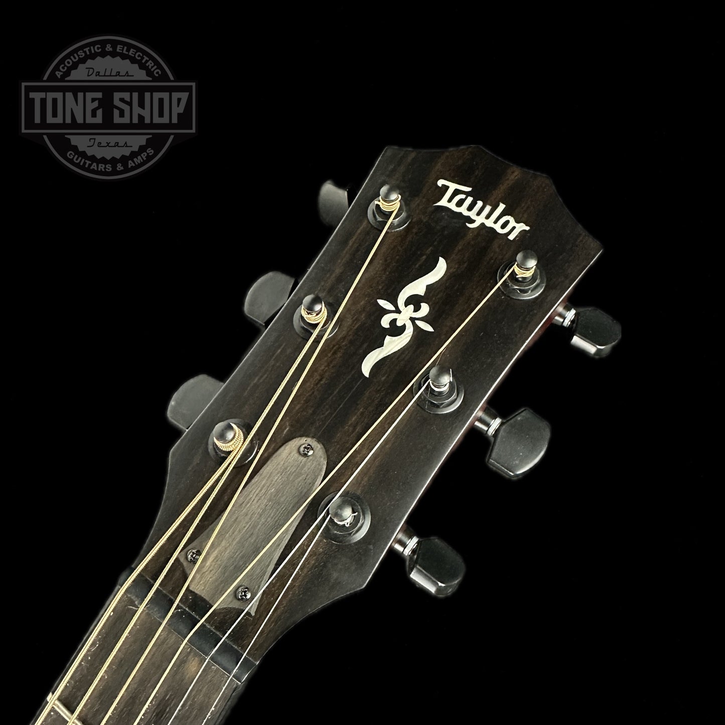 Front of headstock of Used Taylor 424ce Ltd Urban Ash Autumn Burst.