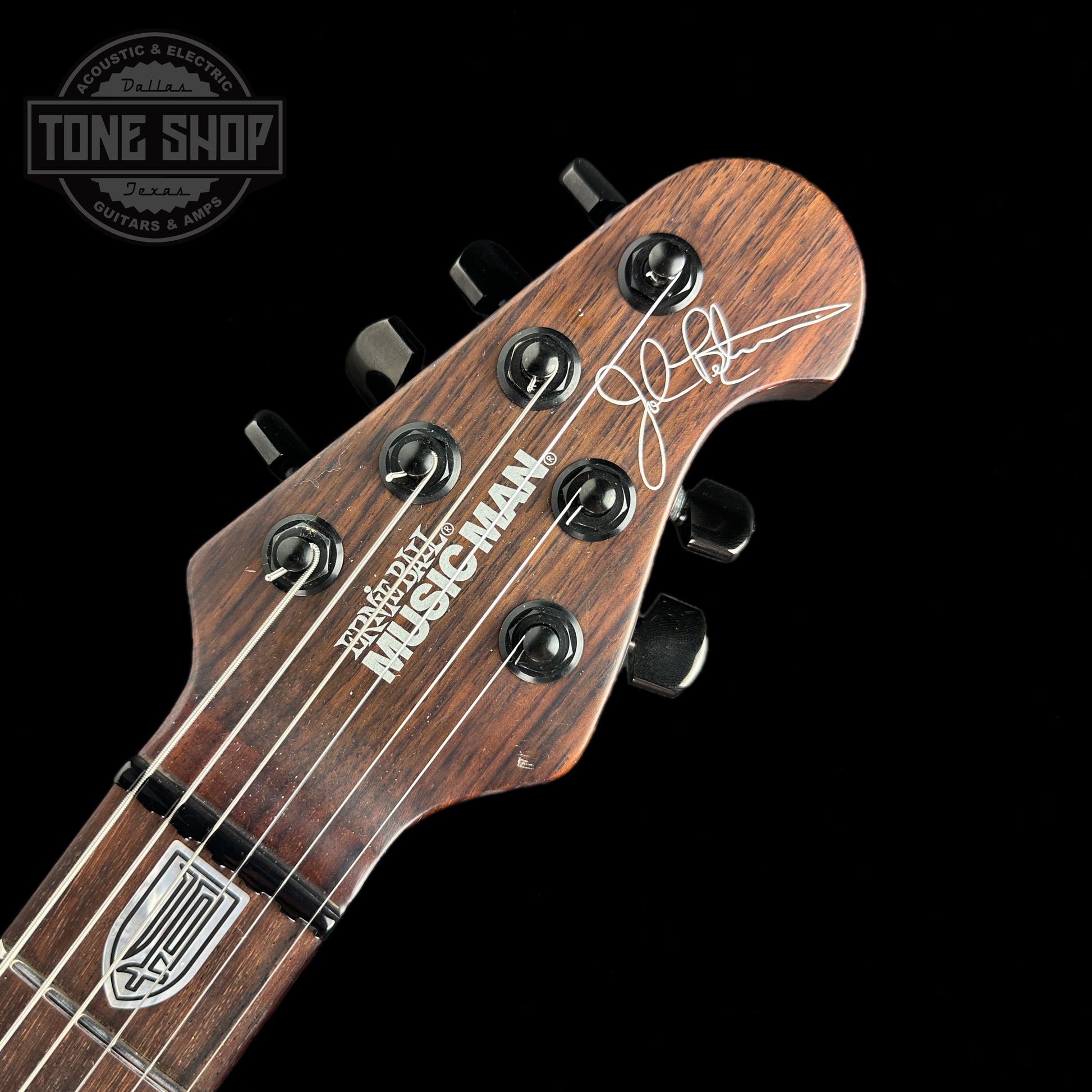 Front of headstock of Used 2014 Ernie Ball JPX Ball Family Reserve RW Neck Barolo.