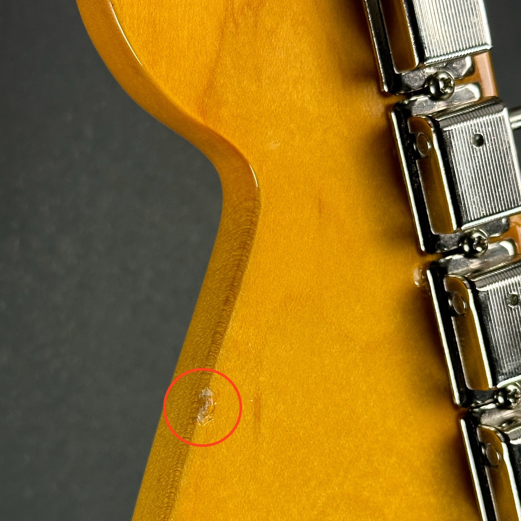 Chip on back of headstock of Used 2016 Fender Johnny Marr Jaguar Metallic KO.