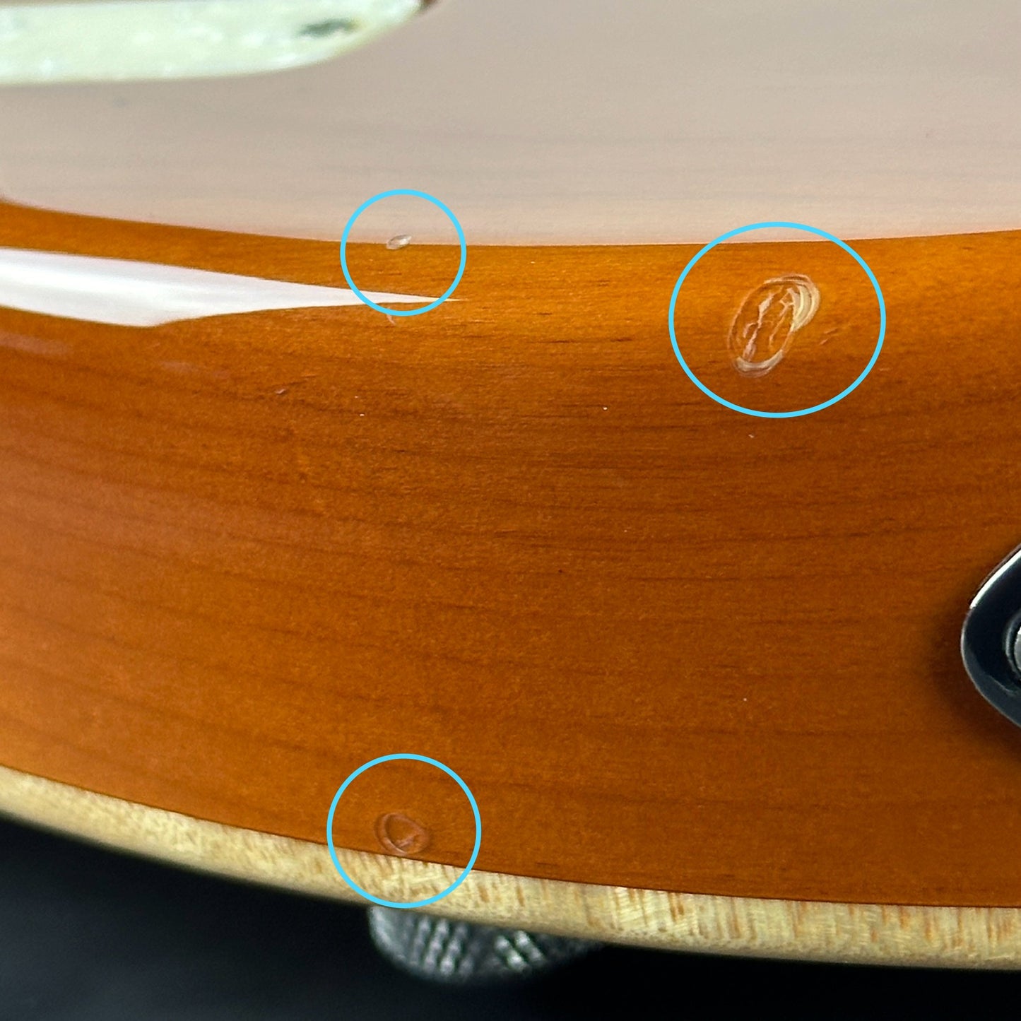 Damage on bottom edge of Used 2008 Tom Anderson Drop Top Classic Natural Honey Burst.