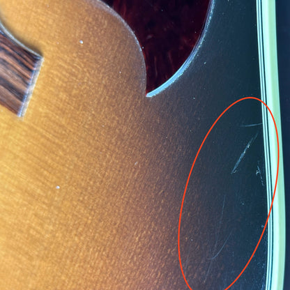 Scratches near pickguard of Used Gibson Hummingbird Pro.