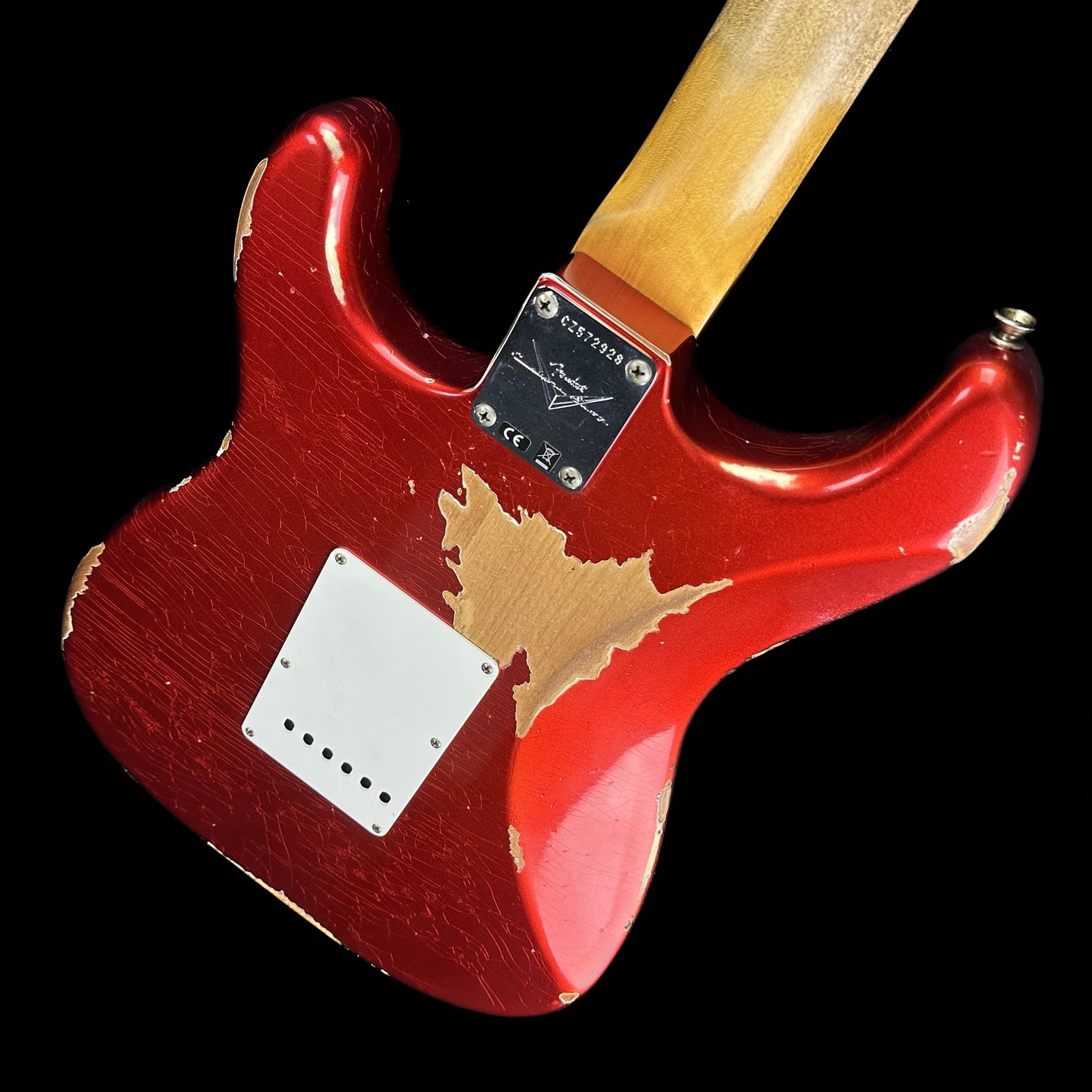 Back angle of Fender Custom Shop 59 Strat Heavy Relic Super Faded Aged Candy Apple Red.