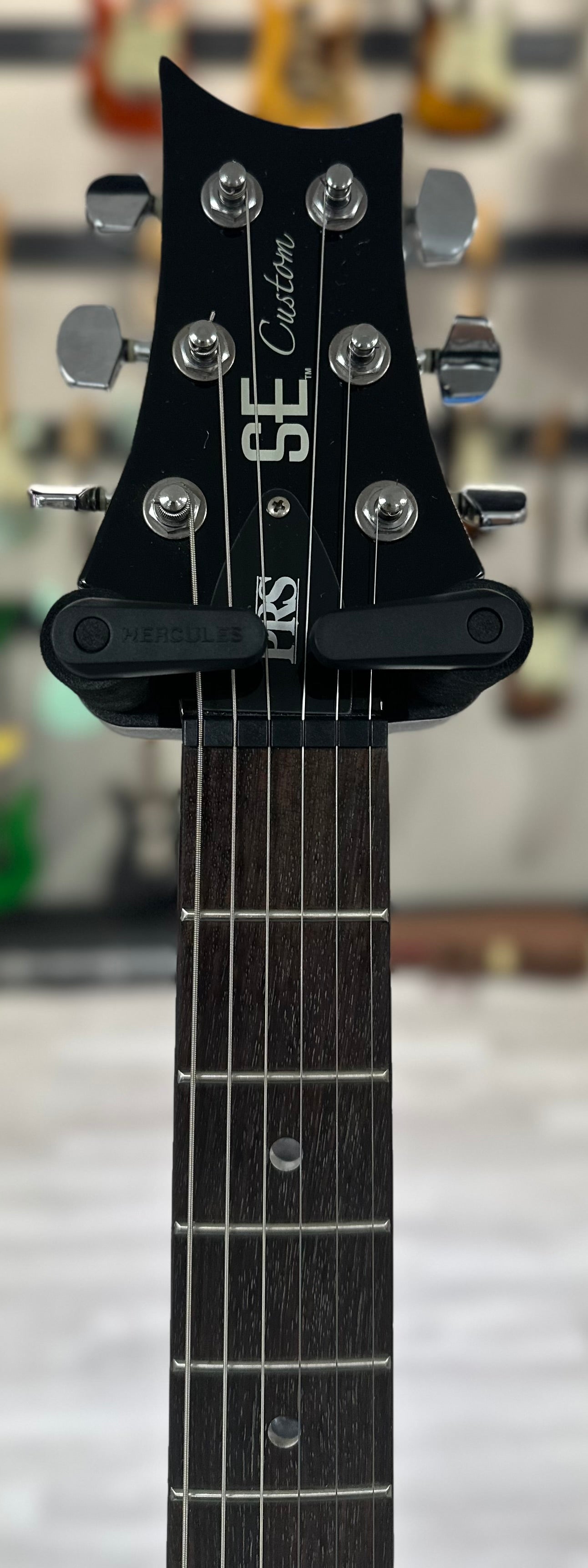 Headstock of Used PRS SE Custom Trans Black w/bag TSS4227Used PRS SE Custom Trans Black w/bag TSS4227