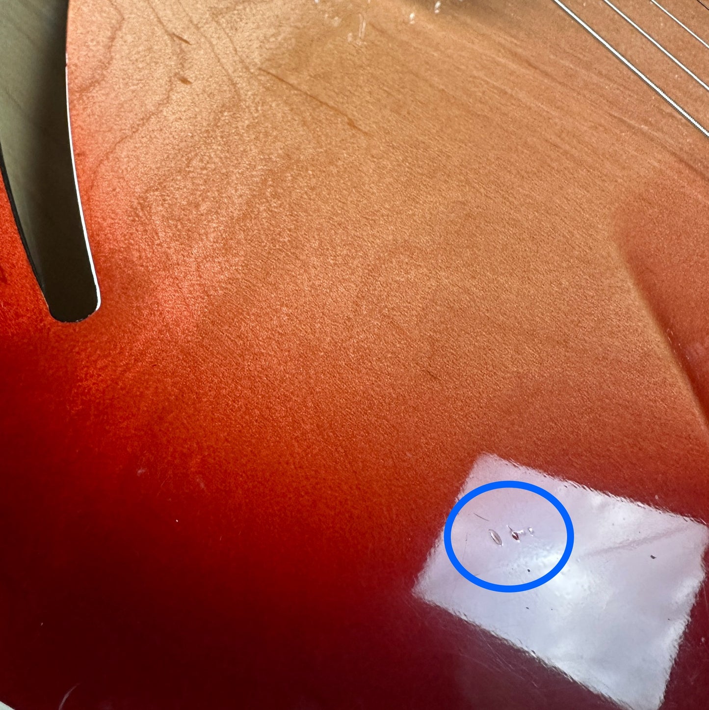 Small dings near soundhole of Used 1997 Rickenbacker 360V64 Fireglow.