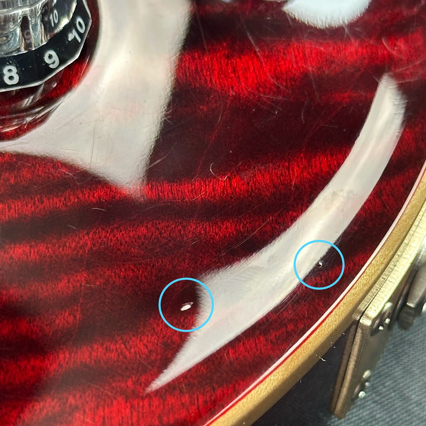Small dings nad scratches near output jack of Used 2019 PRS McCarty 594 Scarlet.