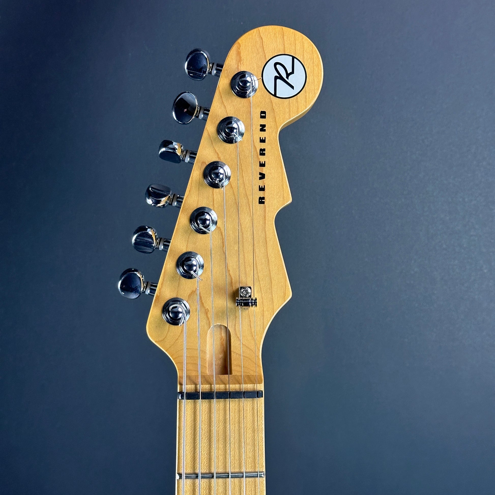 Front of headstock of Used Reverend Kingbolt RA Trans Blue.