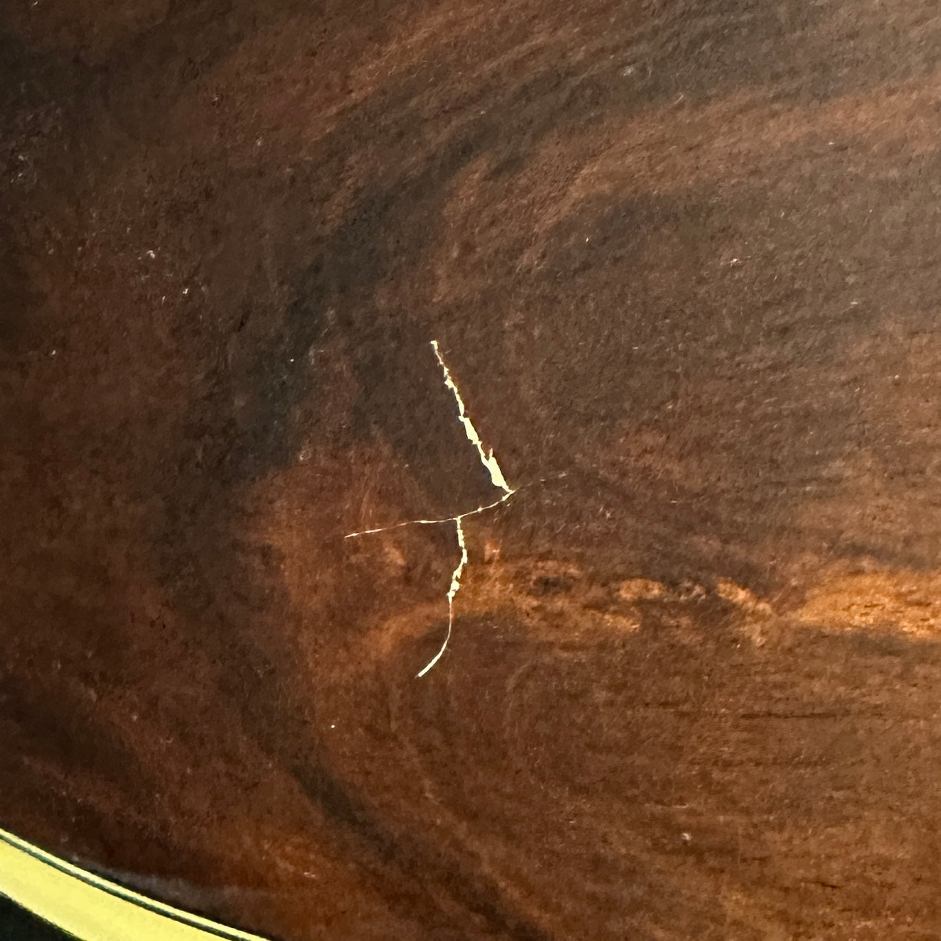 Ding on bottom of guitar.