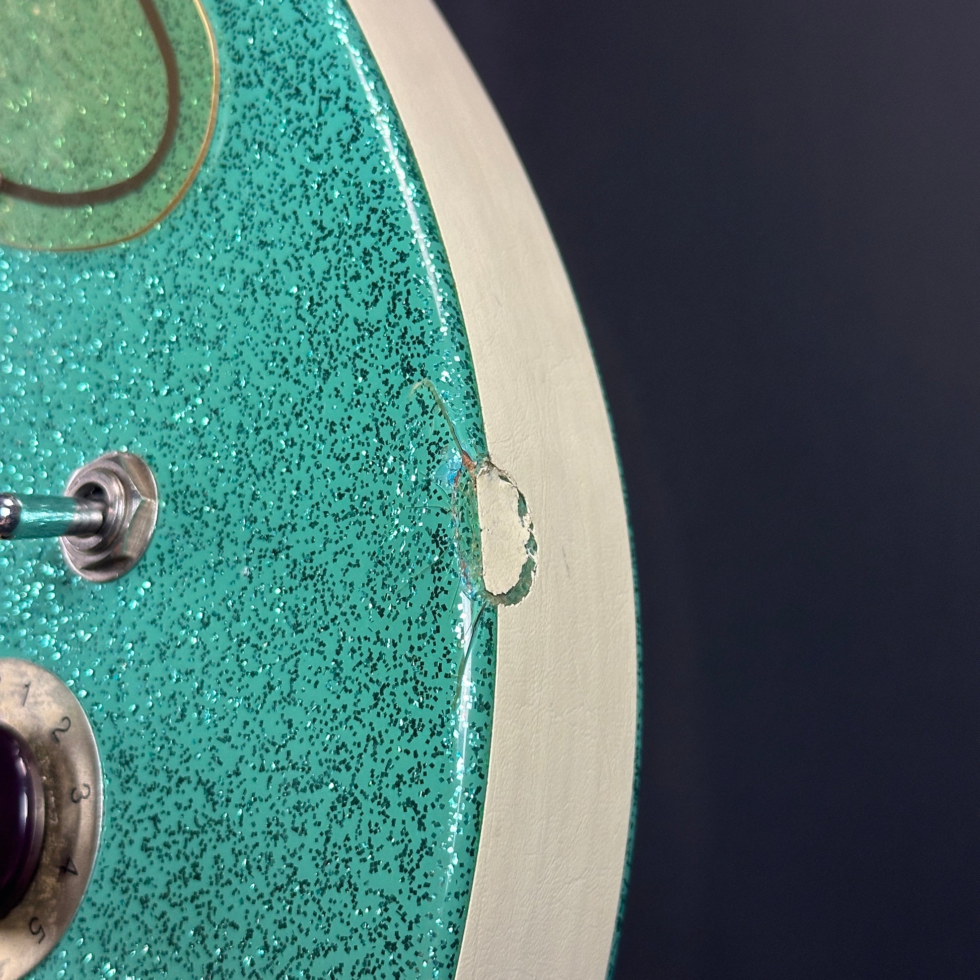 Large dent on side of Used Danelectro '56 U3 Green Sparkle.