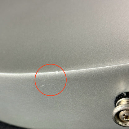 Small dings on bottom of Used 2009 Gibson Les Paul Studio Raw Power Grey.