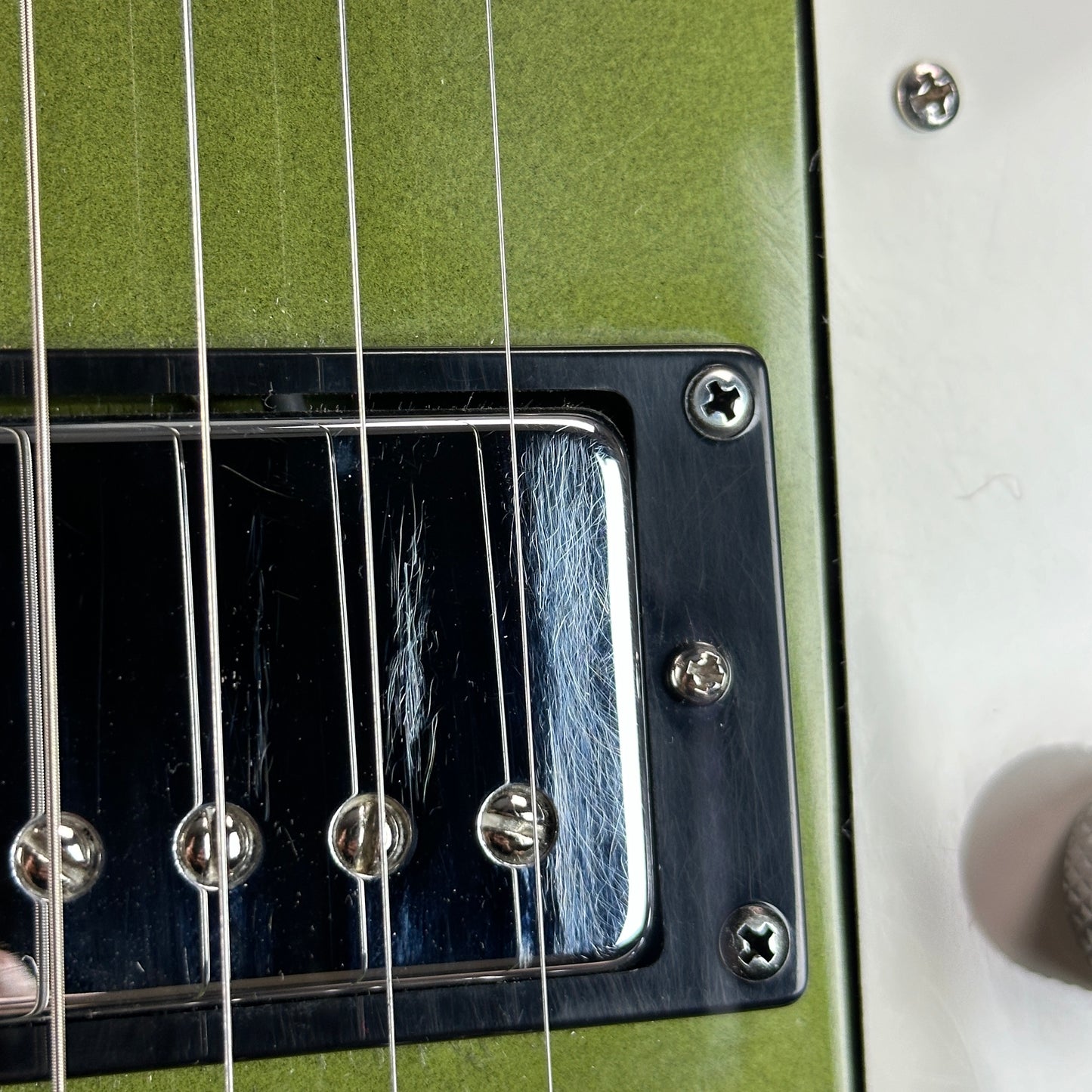 Scratches on pickup of Used Reverend Warwick DAW Avocado Burst.