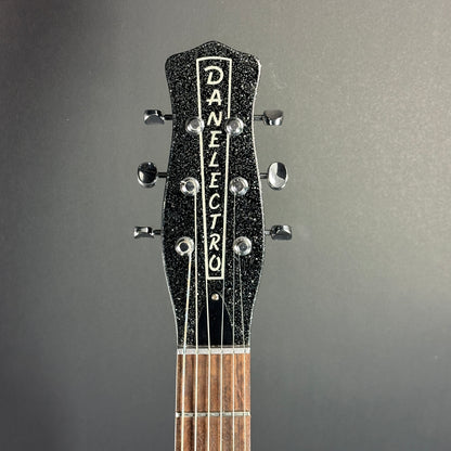 Front of headstock of Used Danelectro '59 DC NOS Black Metal Flake.