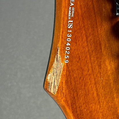 Chip on back of headstock of Used Dean Vendetta Amber.