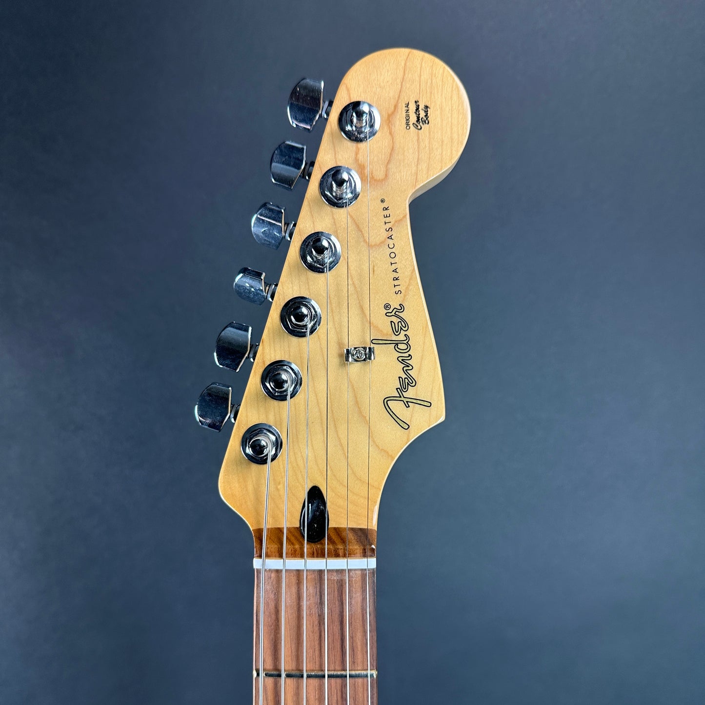 Front of headstock of Used 2024 Fender Player Stratocaster Pau Ferro 2-Tone Sunburst.