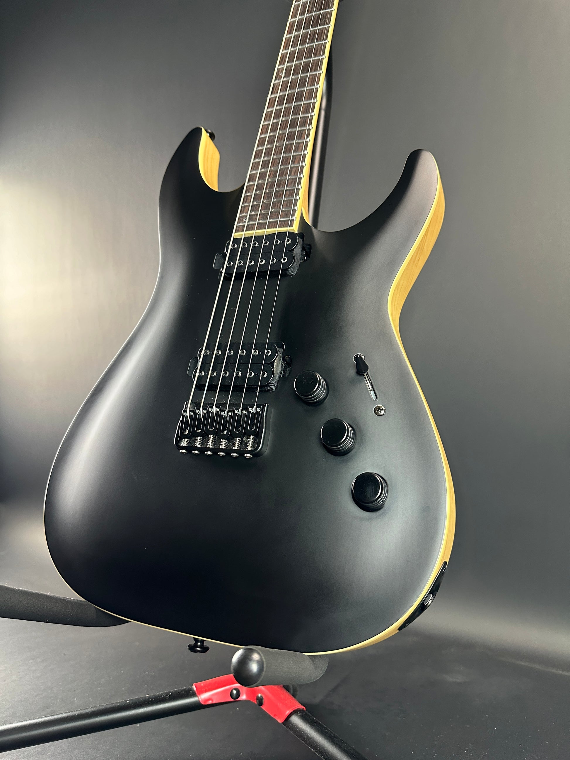 Front angle of Used Schecter C-1 Apocalypse Carbon Black.