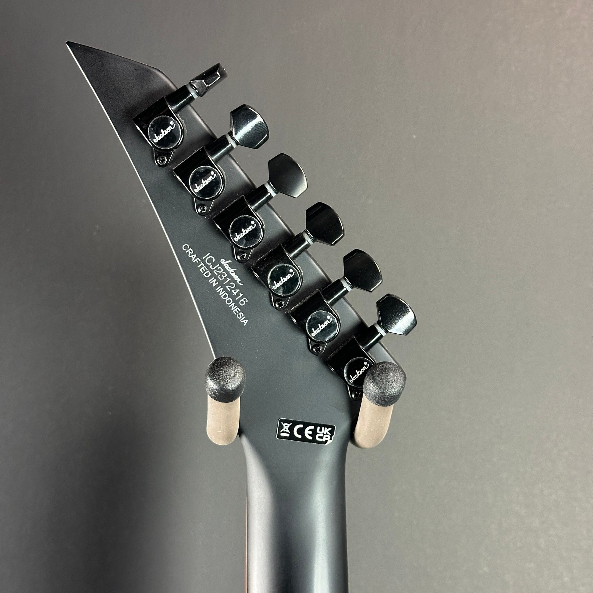 Back of headstock of Used Jackson WRX24 Warrior Black.