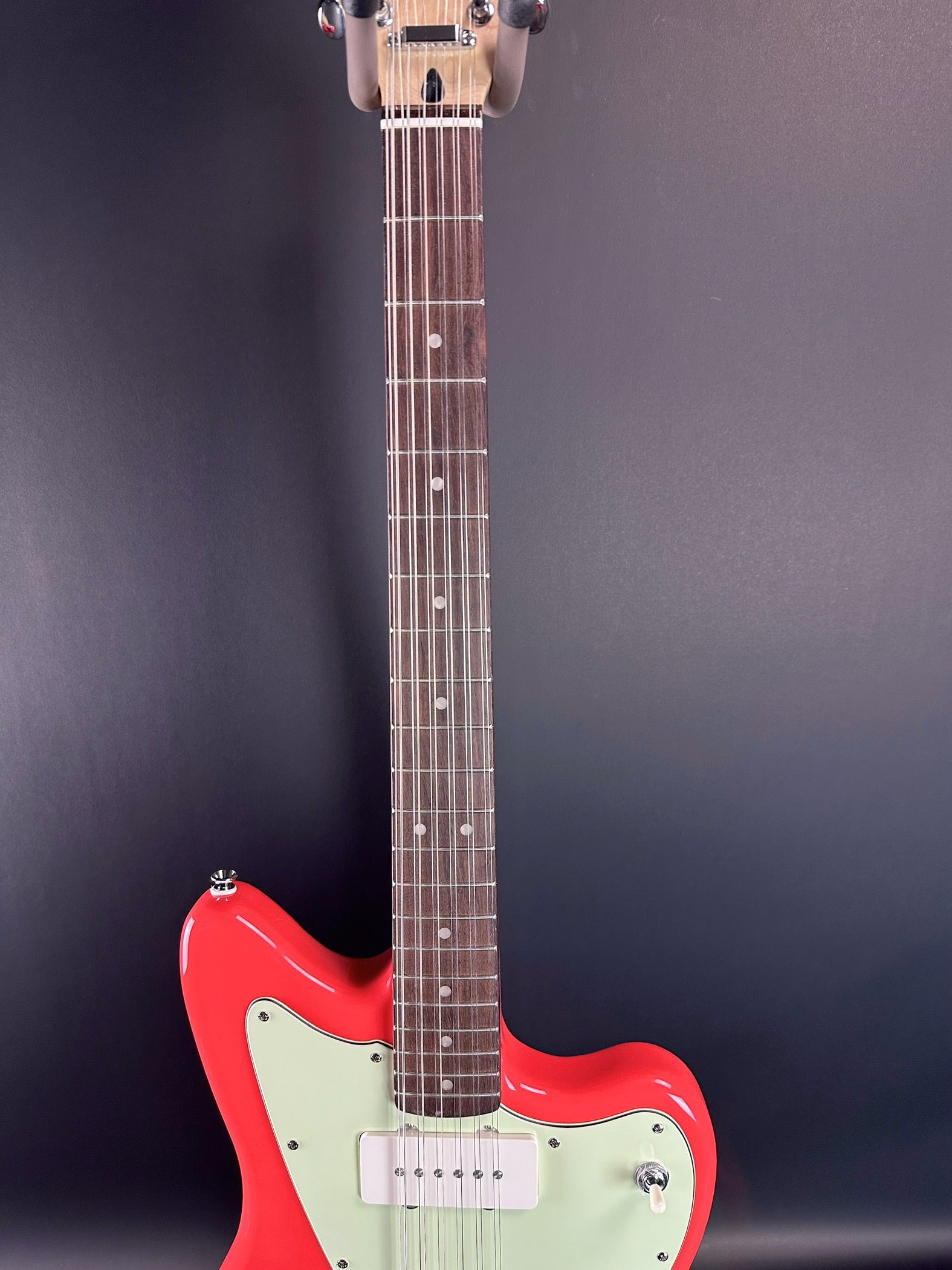 Fretboard of Used Squier Paranormal Jazzmaster XII Fiesta Red.