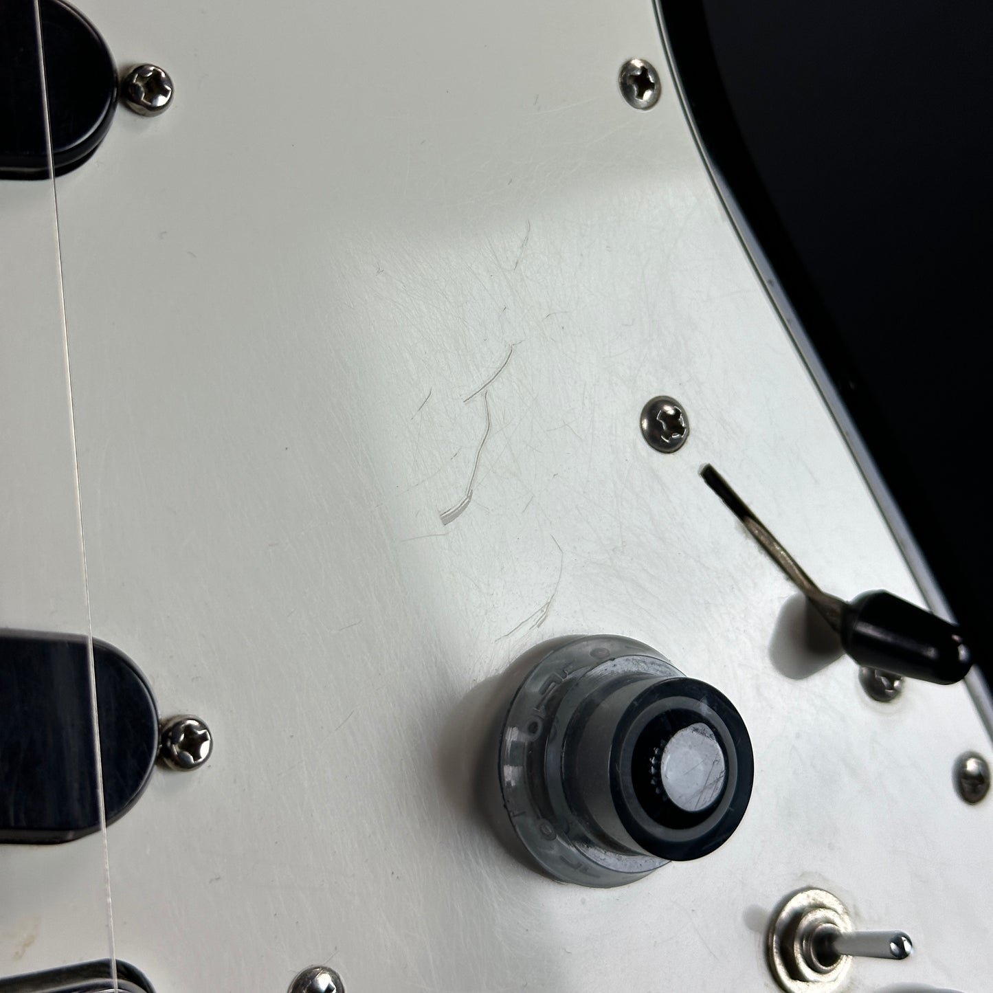 Scratches on pickguard of Used 1984 Ibanez Roadstar II RS-135.